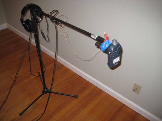 Boom stand holding SPL meter and measurement mic